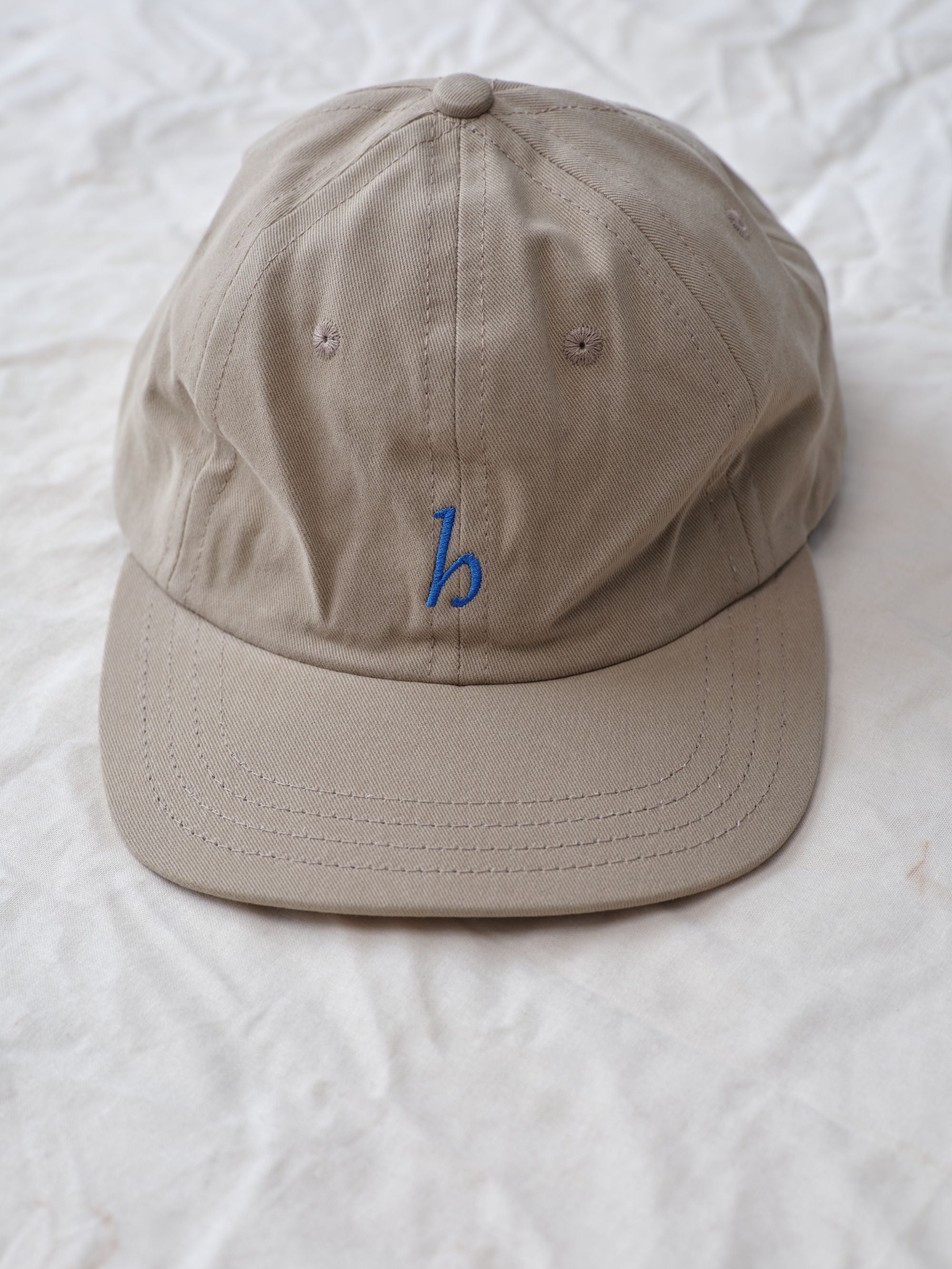 Hanover cap in khaki on textured background