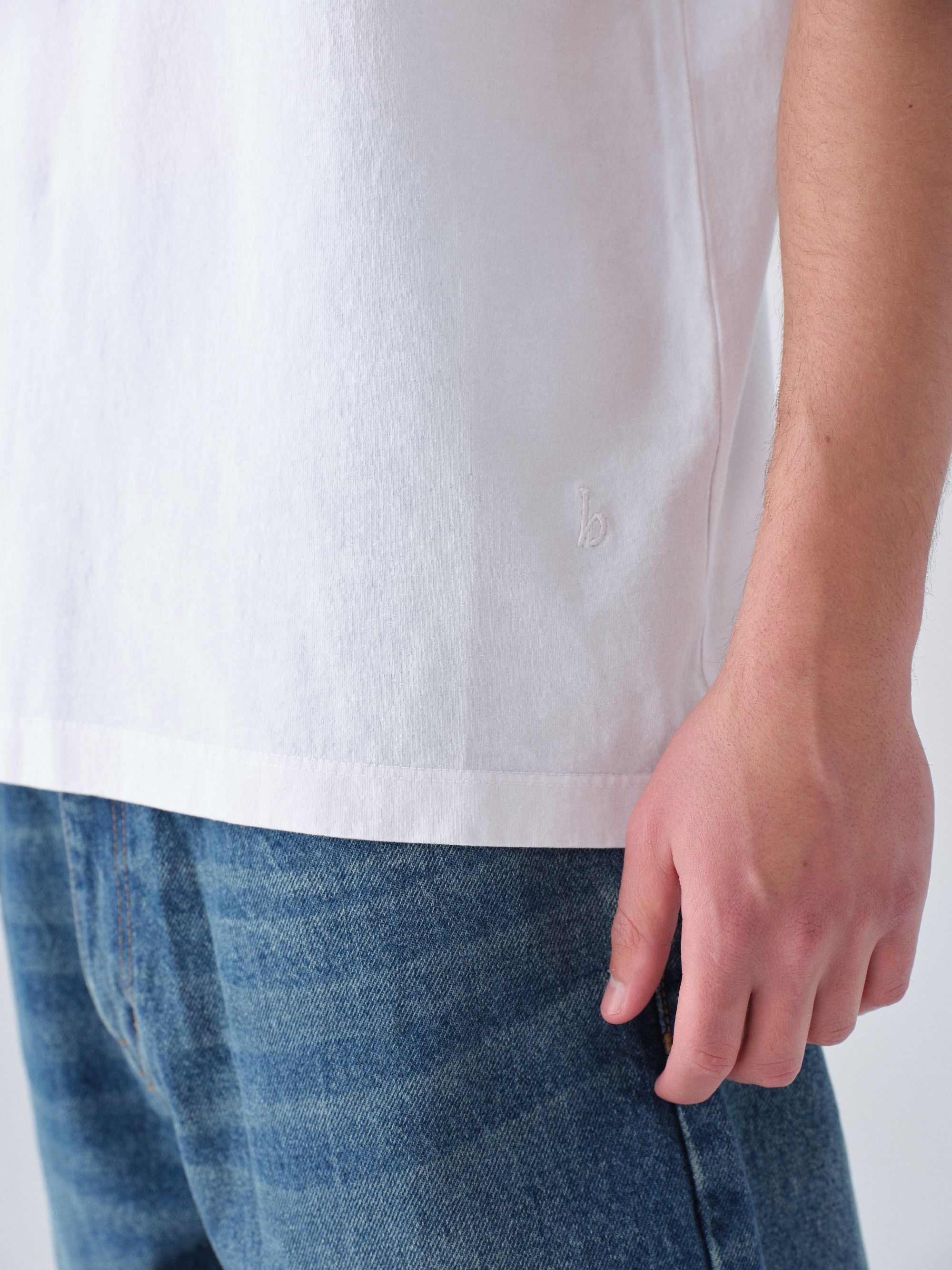 Model guy wearing Staple T-Shirt in white detail close up view