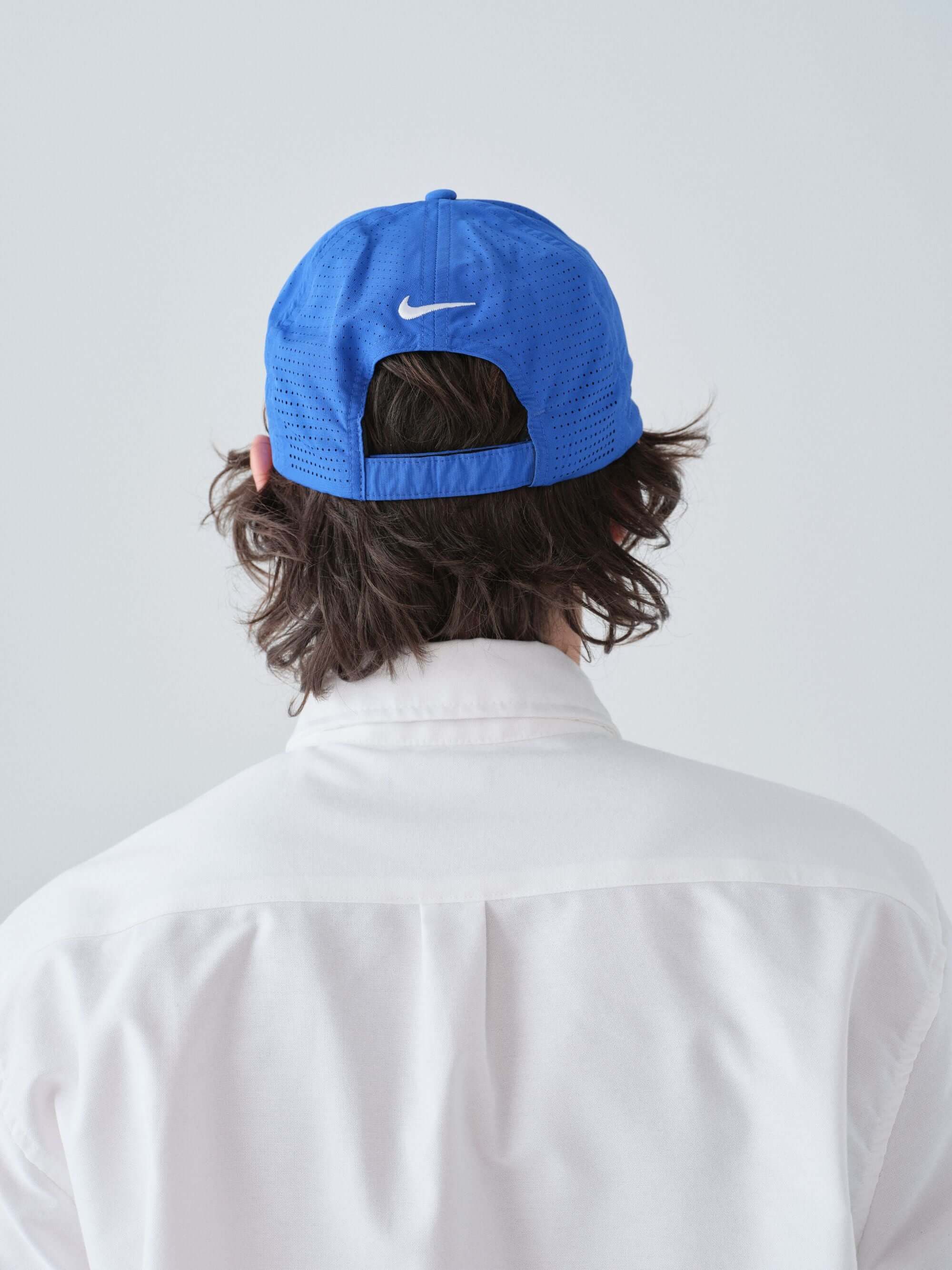 Hanover Performance hat in white on model with 'Hanover' embroidery back view