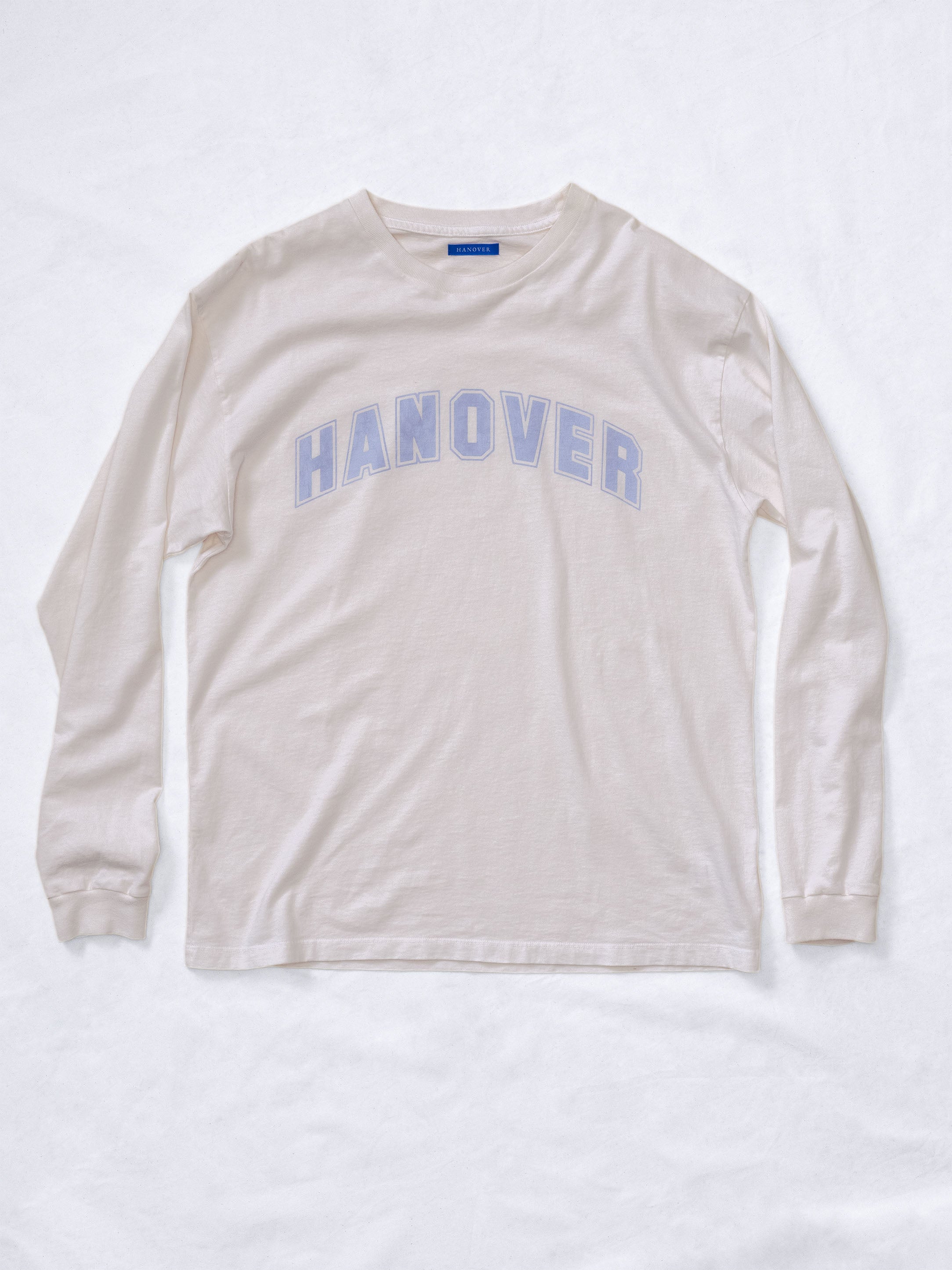 Hanover Long Sleeve Tee in faded light purple graphic on natural washed white cotton, front view.
