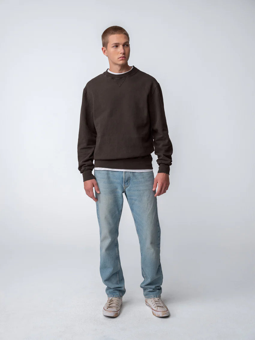 Guy wearing Sunwashed Staple Crewneck in cacao full body view